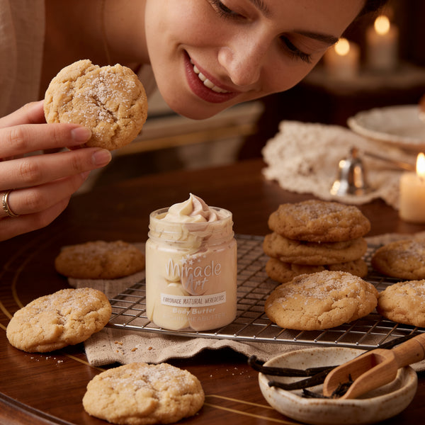 Miracle Art Vanilla Dream body butter styled beside vanilla cookies